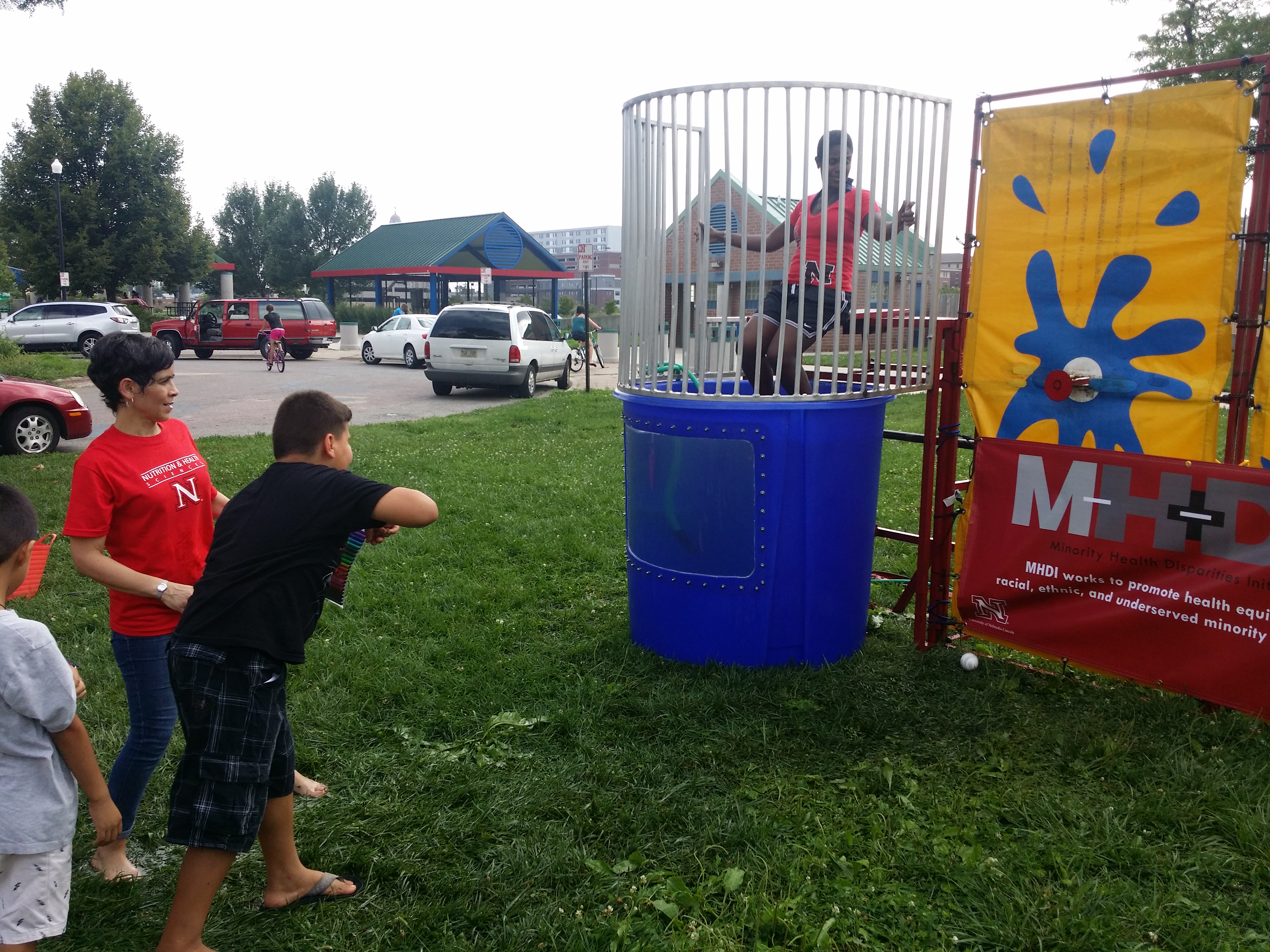 Bridget Goosby, associate professor of sociology and faculty member of the Minority Health Disparities Initiative, awaits a dunk in the tank during the Dunk the Doctor event at the Back to School Jam at Lincoln’s Malone Community Center Aug. 9. The Dunk the Doctor event is one of several MHDI outreaches to strengthen relationships among Nebraskans and UNL researchers.